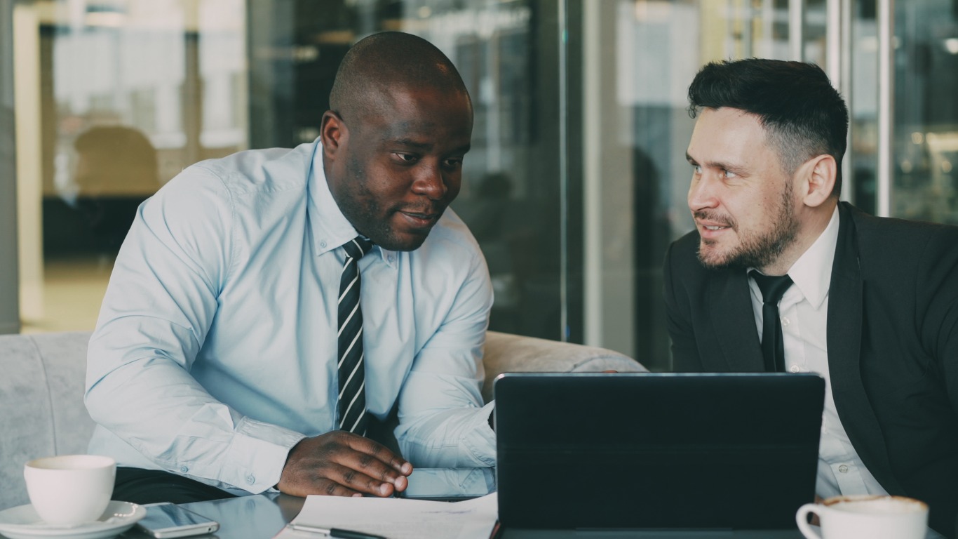 two business colleagues working at laptop